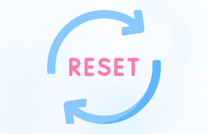 「水色の矢印で円を描くように回転し、その中央にピンク色の文字で“RESET（リセット）”と書かれたシンプルなイラスト。リスタートや再出発、再設定のイメージを表現。」
